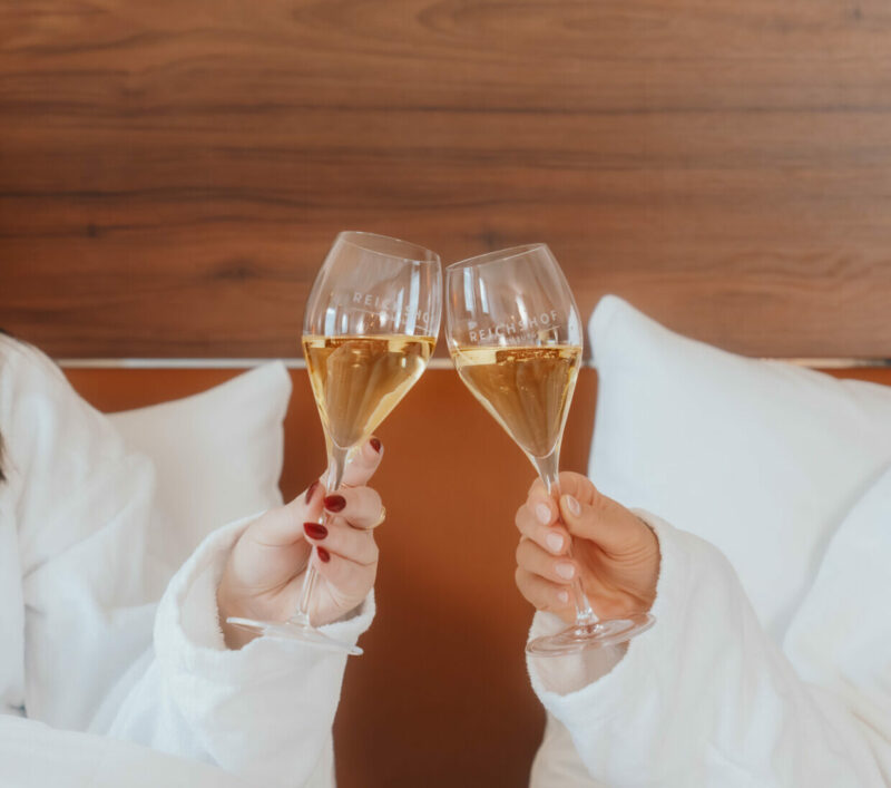 Hands with glasses of sparkling wine