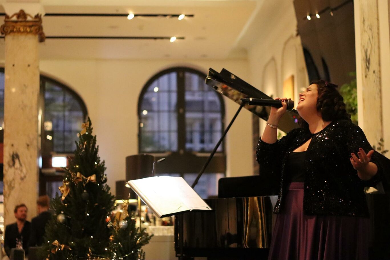 Tonia singing a Christmas concert at the hotels lobby